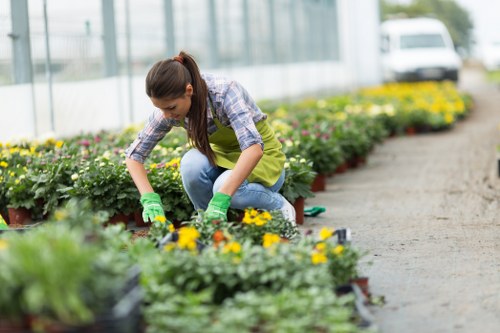 Gardeners following a safety-focused work plan with protective equipment